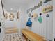 Stylish entryway with beach-themed decor, shiplap walls, and a wooden bench, creating a welcoming atmosphere at 2928 Baywood Dr, Seabrook Island, SC 29455