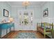 Bright entryway with wainscoting, wood floors, and a decorative chandelier at 2928 Baywood Dr, Seabrook Island, SC 29455