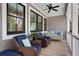 Comfortable porch featuring wicker chairs, a porch swing, and a ceiling fan at 2928 Baywood Dr, Seabrook Island, SC 29455