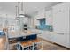 Stylish kitchen island with seating, pendant lighting, and ample storage space at 2928 Baywood Dr, Seabrook Island, SC 29455