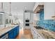 Well-equipped kitchen with an island, cooktop, built-in appliances, and access to the dining area at 2928 Baywood Dr, Seabrook Island, SC 29455