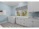 A laundry room featuring a large window, new washer and dryer, and decorative tile floors at 2928 Baywood Dr, Seabrook Island, SC 29455