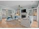 Comfortable living room with fireplace, built-in shelving, and hardwood floors at 2928 Baywood Dr, Seabrook Island, SC 29455