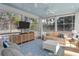 Inviting screened-in porch features comfortable seating and a beautiful view of the surrounding landscape at 2928 Baywood Dr, Seabrook Island, SC 29455