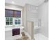 Bright bathroom featuring a soaking tub, a glass-enclosed shower, and a window for natural light at 299 Hobcaw Dr, Mount Pleasant, SC 29464