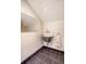 A charming bathroom with a white sink, black tile floors, and a bright mirror at 299 Hobcaw Dr, Mount Pleasant, SC 29464