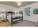 Comfortable bedroom featuring a black bed frame, green ceiling, and a large window at 299 Hobcaw Dr, Mount Pleasant, SC 29464
