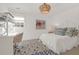 Charming bedroom with a cozy desk area and a beautifully decorated bed with patterned pillows at 299 Hobcaw Dr, Mount Pleasant, SC 29464