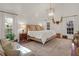 Bright, inviting bedroom featuring a king-size bed, vaulted ceilings, and large windows for natural light at 299 Hobcaw Dr, Mount Pleasant, SC 29464
