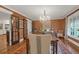 Beautiful dining room with chandelier, rich wall covering, and access to the kitchen at 299 Hobcaw Dr, Mount Pleasant, SC 29464
