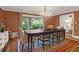 Formal dining area boasts large window, stylish seating, area rug, and elegant chandelier at 299 Hobcaw Dr, Mount Pleasant, SC 29464