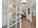 Inviting entryway featuring hardwood floors, decorative lighting, and views of the living room at 299 Hobcaw Dr, Mount Pleasant, SC 29464