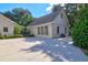 Rear exterior elevation of white painted brick home featuring a long driveway at 299 Hobcaw Dr, Mount Pleasant, SC 29464