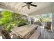 Charming backyard patio with a rustic table and tropical landscaping at 299 Hobcaw Dr, Mount Pleasant, SC 29464