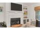 Living room highlighting a fireplace, built-in shelves, and natural light coming in through the window at 299 Hobcaw Dr, Mount Pleasant, SC 29464