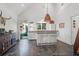 Kitchen features white cabinets and countertops, stainless steel appliances, and open doorway to the yard at 299 Hobcaw Dr, Mount Pleasant, SC 29464