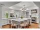 Bright kitchen featuring a center island with seating, modern lighting, and stainless-steel appliances at 299 Hobcaw Dr, Mount Pleasant, SC 29464