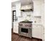Gourmet kitchen featuring stainless steel range, designer backsplash, and custom cabinetry at 299 Hobcaw Dr, Mount Pleasant, SC 29464