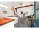 Open concept living room shows a kitchen, living, and bedroom area, with a ladder to the loft, and natural lighting at 299 Hobcaw Dr, Mount Pleasant, SC 29464