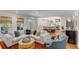 Spacious living room showcases an open floor plan leading to the kitchen and backyard views at 299 Hobcaw Dr, Mount Pleasant, SC 29464