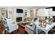 Well-decorated living room with a fireplace, comfortable seating, a stylish coffee table, and a table lamp at 299 Hobcaw Dr, Mount Pleasant, SC 29464