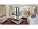 Open-concept living room with a view to the kitchen, hardwood floors, and comfortable furniture at 299 Hobcaw Dr, Mount Pleasant, SC 29464