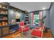 Stylish home office with custom built-ins, designer lighting, a comfortable chair, and a treadmill at 299 Hobcaw Dr, Mount Pleasant, SC 29464