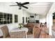 Cozy outdoor space with wicker furniture, fireplace, and views of the green surroundings at 299 Hobcaw Dr, Mount Pleasant, SC 29464