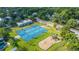 Aerial view of a community park featuring a basketball court, playground, and green spaces at 313 Queen St, Mount Pleasant, SC 29464