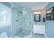 Beautiful bathroom with white subway tile shower, glass door and white vanity at 313 Queen St, Mount Pleasant, SC 29464