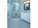 Bathroom showcasing a glass shower, vintage mosaic tile, and a modern vanity at 313 Queen St, Mount Pleasant, SC 29464