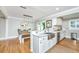 Well-designed kitchen and dining area with stainless appliances, marble countertops, and seamless flow, perfect for cooking and entertaining at 313 Queen St, Mount Pleasant, SC 29464
