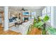 Bright living room with hardwood floors, a cozy fireplace, and stylish furniture at 313 Queen St, Mount Pleasant, SC 29464