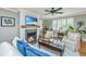 Inviting living room with a cozy fireplace, shiplap accent wall, and comfortable seating arrangement, creating a relaxing atmosphere at 313 Queen St, Mount Pleasant, SC 29464