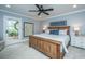 Comfortable bedroom featuring a ceiling fan, neutral walls, and access to the outdoors at 313 Queen St, Mount Pleasant, SC 29464
