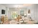 Open living space with dining table, patio doors, and stylish decor with modern lighting at 321 Pine Crest View Dr, Summerville, SC 29486