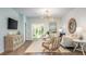 Comfortable open living space, light blue walls, patio doors, and modern lighting at 321 Pine Crest View Dr, Summerville, SC 29486