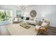 Cozy living room featuring comfortable seating, a stylish rug, and plenty of natural light at 321 Pine Crest View Dr, Summerville, SC 29486