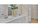 Bright bathroom featuring double vanity, white cabinets, and a large mirror at 334 Pine Crest View Dr, Summerville, SC 29486