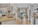 Open kitchen with granite countertops, stainless steel appliances, and a breakfast nook with lake views at 334 Pine Crest View Dr, Summerville, SC 29486