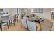 Open-concept living area with bar seating, comfortable seating, and modern decor at 334 Pine Crest View Dr, Summerville, SC 29486