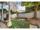 Secluded backyard with lush greenery, brick patio, and a tranquil atmosphere at 38 State St # 2, Charleston, SC 29401