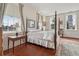 Bright bedroom featuring many windows, hardwood floors, and neutral colors at 38 State St # 2, Charleston, SC 29401