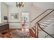 Inviting entryway featuring hardwood floors, chandelier, and a view into a bedroom at 38 State St # 2, Charleston, SC 29401
