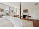 Spacious main bedroom boasts hardwood floors, fireplace, and four-poster bed at 38 State St # 2, Charleston, SC 29401