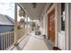 Expansive porch with columns providing shade and classic architectural appeal at 38 State St # 2, Charleston, SC 29401