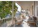 Covered porch with comfortable seating, offering an inviting outdoor living space at 38 State St # 2, Charleston, SC 29401