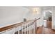 Traditional stairway with wood and white accents, and a view into an adjacent room at 38 State St # 2, Charleston, SC 29401