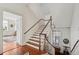 Classic stairway with hardwood steps and white risers leading to the upper levels at 38 State St # 2, Charleston, SC 29401