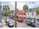 Charming street view featuring colorful houses and palm trees in a historic neighborhood at 38 State St # 2, Charleston, SC 29401